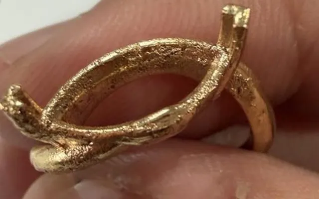 As-cast gold marquise ring setting with a rough, grainy surface