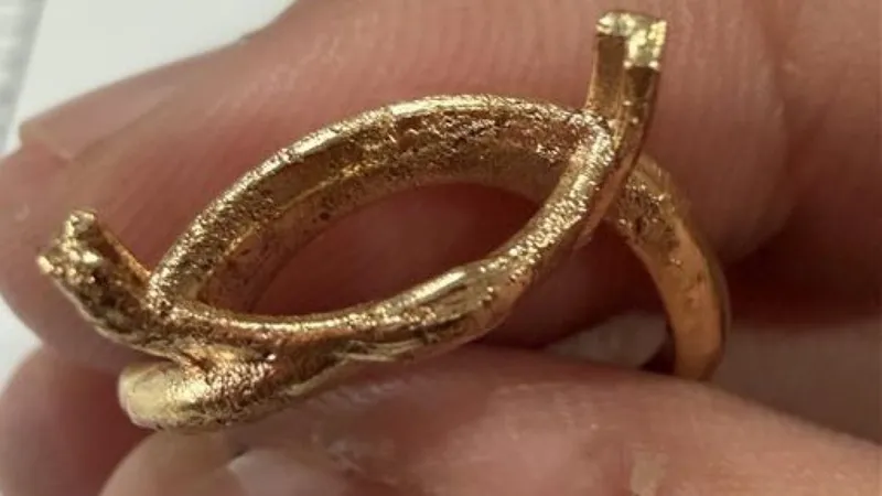 As-cast gold marquise ring setting with a rough, grainy surface
