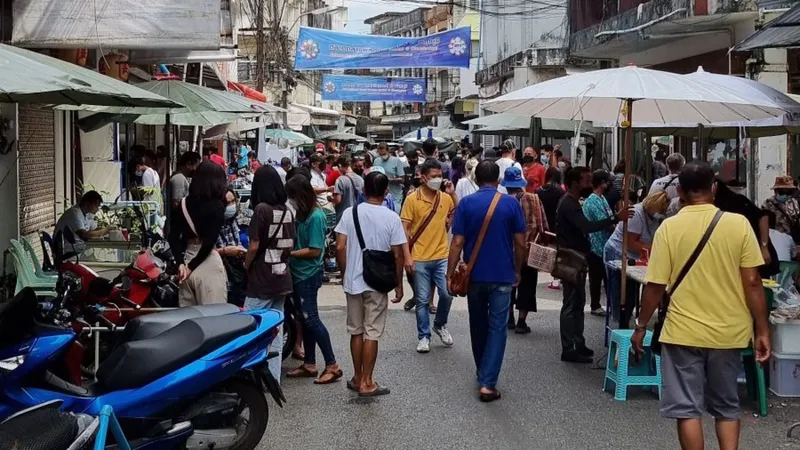 Gem market street in Thailand with traders at their stalls